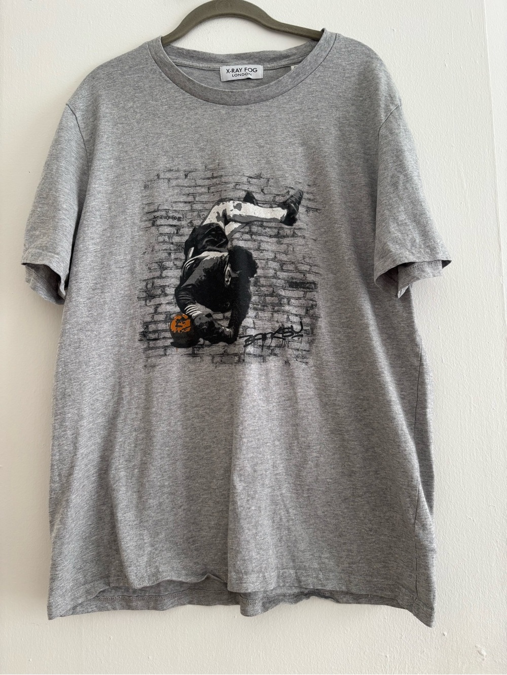 Banksy soccer T-shirt
